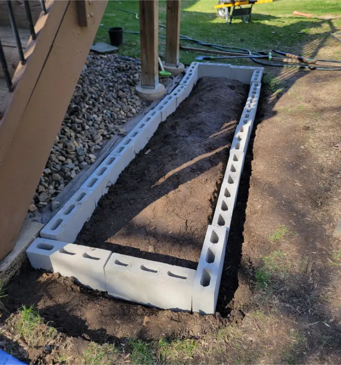 Concrete Block Placement - The Start of Leveling Base for Raised Bed