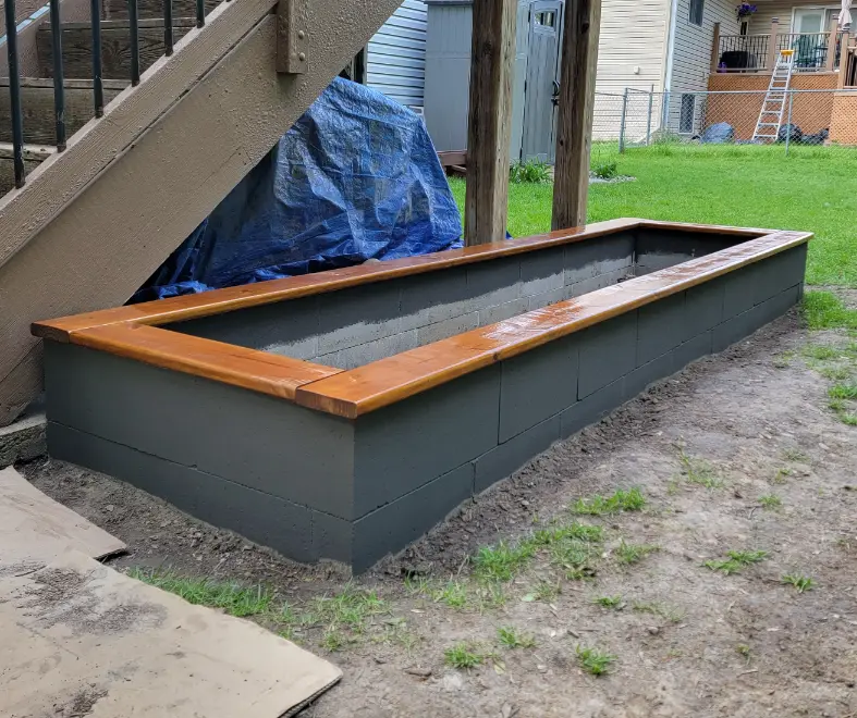 Added stained Wood Frame Around Budget Friendly Raised Bed